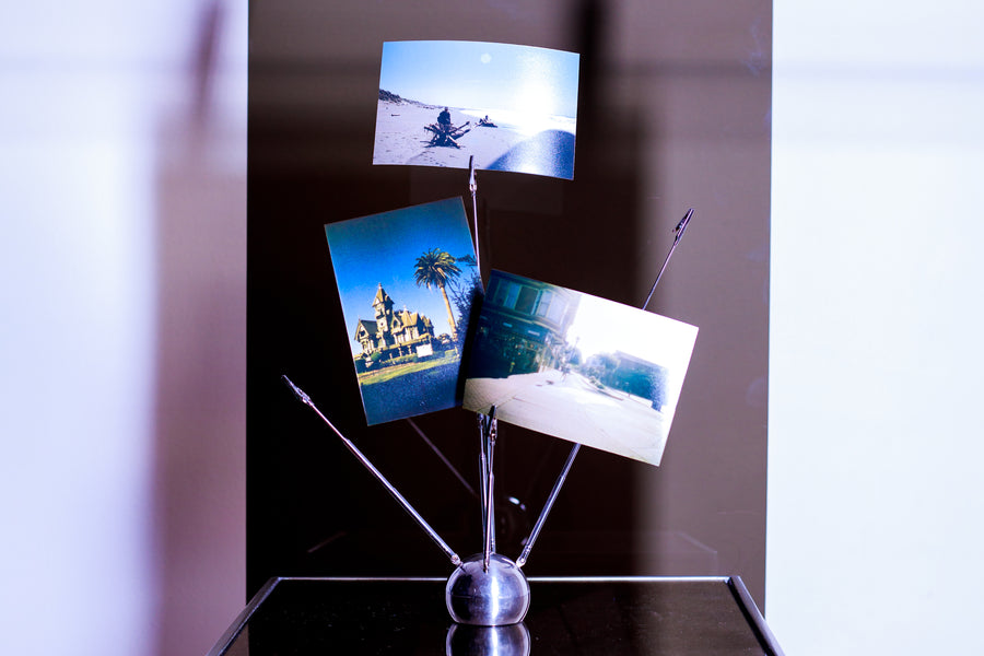 Chrome arm photo holder